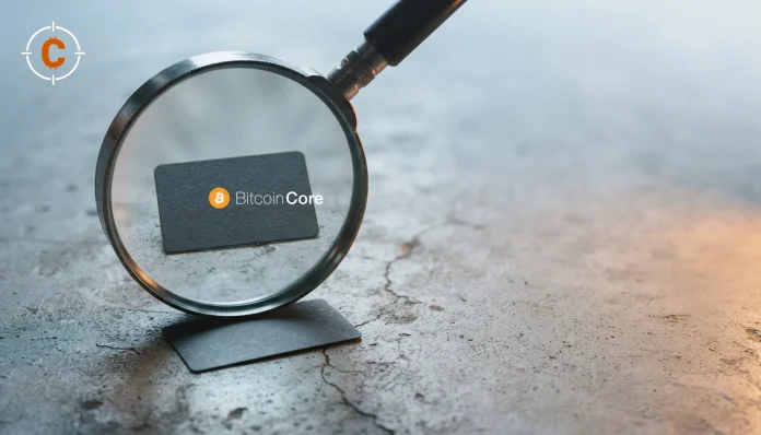 Magnifying glass over a dark card bearing the official Bitcoin Core logo, illustrating an output lookup.